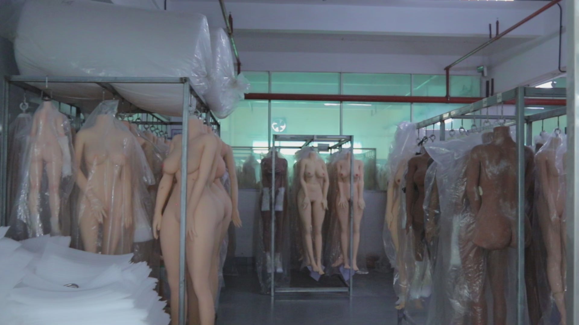 Load video: 
A display of various styles of finished sex dolls in stock.
